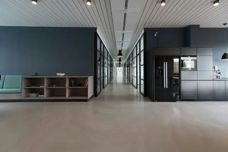 Open commercial office with dark feature walls